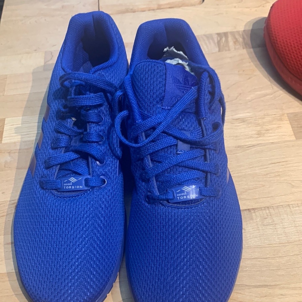 Blue zx flux by adidas. Great shape barely worn
